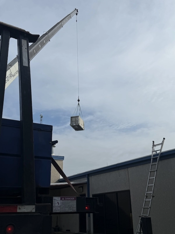 Packaged HVAC unit installed on a slab outside a home